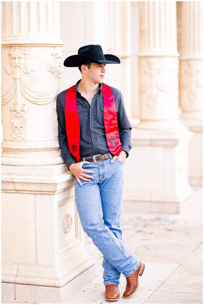 Texas Tech senior guy wearing boots and cowboy hat