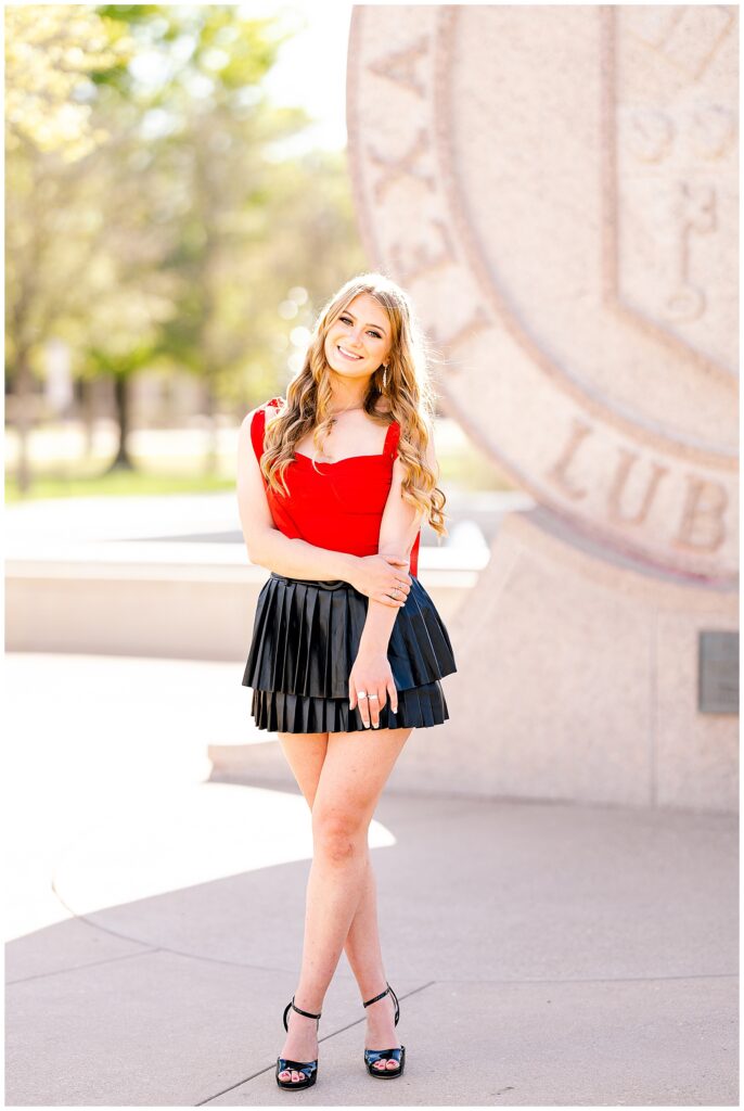 Texas Tech campus rep in front of the seal